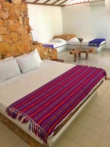 A bed or beds in a room at Finca Vallescondido