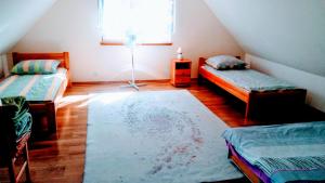 מיטה או מיטות בחדר ב-Bocianie Siedlisko