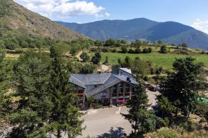 an aerial view of a building in the mountains at Casa Joana - Apartamento La Colomina- se admiten mascotas in Bernúy