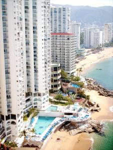 an aerial view of a beach and buildings at Hotel Las Torres Gemelas Acapulco in Acapulco