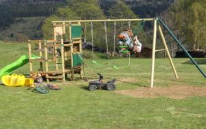 a group of children playing on a playground at Les Chantenées in La Bresse