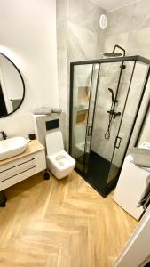 Et badeværelse på Apartament Urodzajna