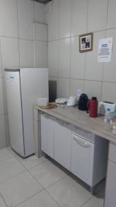 A kitchen or kitchenette at Hostel Pininha