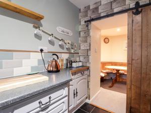 Η κουζίνα ή μικρή κουζίνα στο Griffin Cottage +17 φωτογραφίες