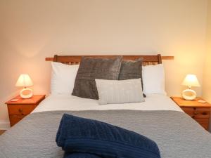 מיטה או מיטות בחדר ב-Barley Meadow