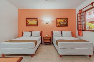 Postel nebo postele na pokoji v ubytování Hotel Santa María Mérida