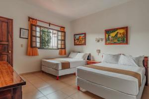 Postel nebo postele na pokoji v ubytování Hotel Santa María Mérida