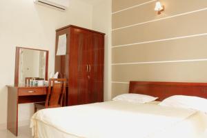 Ένα ή περισσότερα κρεβάτια σε δωμάτιο στο YaYa Sai Gon Hotel Bui Vien Walking Street