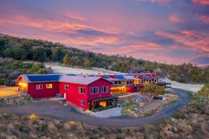 an aerial view of a home with a red house at Quiet Mind Mountain Lodge, Retreat & Spa in Julian