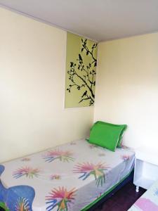 מיטה או מיטות בחדר ב-Hostal Mariella