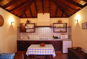 a kitchen with a table with a table cloth on it at Casa Bana 2 in El Paso