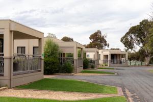 a row of houses on a street at Berri Riverside Holiday Park in Berri