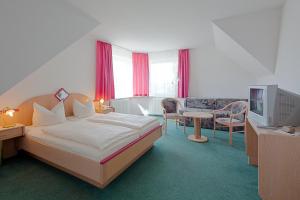 Кровать или кровати в номере Hotel Jahnke