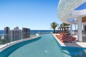 a swimming pool on the roof of a building at The Gallery Residences Broadbeach in Gold Coast