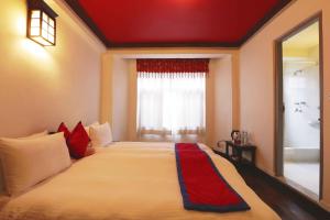 Voodi või voodid majutusasutuse Shambaling Boutique Hotel toas
