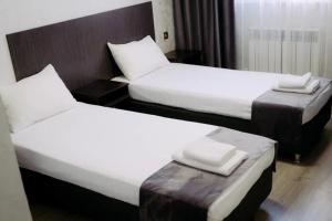 Кровать или кровати в номере Rush Hotel