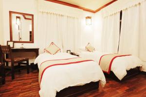 Voodi või voodid majutusasutuse Shambaling Boutique Hotel toas
