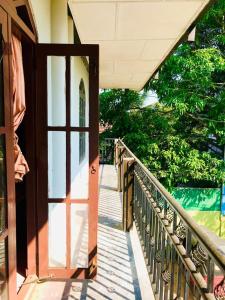 an open door to a house with a balcony at Araliya hotel in Gampaha
