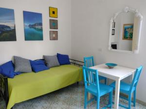 a living room with a couch and a table at Soleluna in Capri
