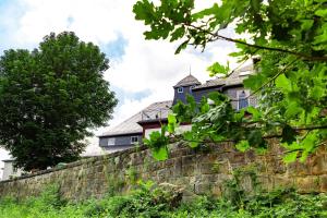 a building on top of a stone wall at Haus Seeblick in Dippoldiswalde