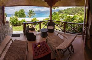 A balcony or terrace at Anse Soleil Beachcomber Hotel and Self Catering