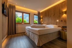 Postel nebo postele na pokoji v ubytování Apparthotel Thalerhof