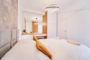 Postel nebo postele na pokoji v ubytování Apartament HORYZONT "ZŁOTA"