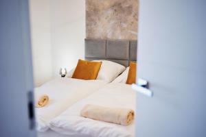 Postel nebo postele na pokoji v ubytování Apartament HORYZONT "ZŁOTA"