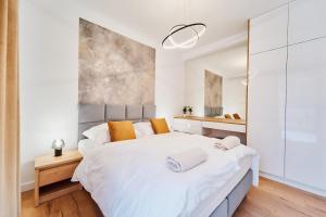 Postel nebo postele na pokoji v ubytování Apartament HORYZONT "ZŁOTA"