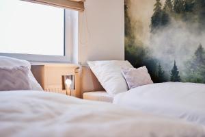 Postel nebo postele na pokoji v ubytování Apartament HORYZONT "ZŁOTA"
