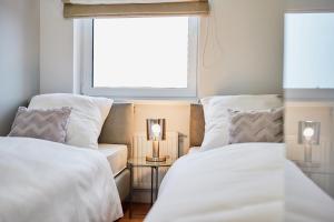 Postel nebo postele na pokoji v ubytování Apartament HORYZONT "ZŁOTA"