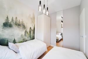 Postel nebo postele na pokoji v ubytování Apartament HORYZONT "ZŁOTA"