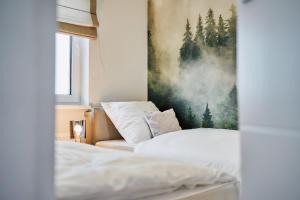 Postel nebo postele na pokoji v ubytování Apartament HORYZONT "ZŁOTA"