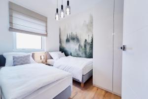Postel nebo postele na pokoji v ubytování Apartament HORYZONT "ZŁOTA"