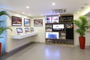 a store with several televisions on the wall at Red Planet Cubao Aurora Boulevard in Manila +35 photos