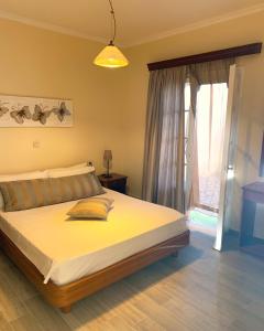 A bed or beds in a room at Natalia Apartment B with panoramic sea views of Agios Gordios bay