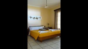 A bed or beds in a room at Natalia Apartment B with panoramic sea views of Agios Gordios bay