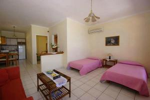 A bed or beds in a room at Natalia Apartment B with panoramic sea views of Agios Gordios bay