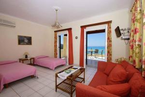 A bed or beds in a room at Natalia Apartment B with panoramic sea views of Agios Gordios bay