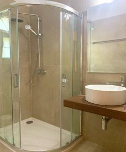 A bathroom at Natalia Apartment B with panoramic sea views of Agios Gordios bay