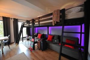 a room with two bunk beds with a skateboard in it at VILA GIGI, ideala pentru relaxare si distractie! in Breaza +81 photos