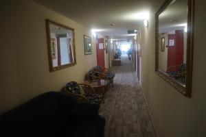 Posezení v ubytování Hotel Ajka Üzletház Panzió Ajka