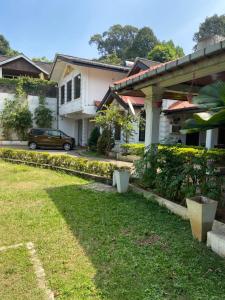 a car parked in front of a house at Kandy Garden Villa in Kandy