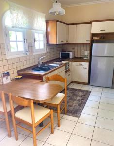 Kuchyň nebo kuchyňský kout v ubytování Natalia Loft Apartment C with panoramic sea views of Agios Gordios bay + 31 fotografií