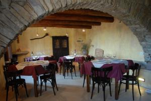 a dining room with tables and chairs in a building at Il Mandorlo in Montecorice