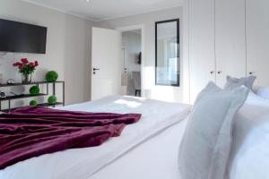 Кровать или кровати в номере Stadtperle Silver