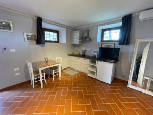 Kuchyň nebo kuchyňský kout v ubytování Casa vacanze La Foresteria
