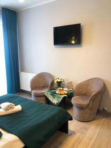 Telewizja i/lub zestaw kina domowego w obiekcie Hotel Restauracja U Guta
