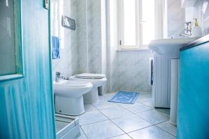 a bathroom with a toilet and a sink at Terrazza Lungomare, e sei in spiaggia... in Cala Gonone
