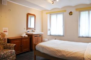 Posteľ alebo postele v izbe v ubytovaní Gîte Le petit coin de paradis Sautin